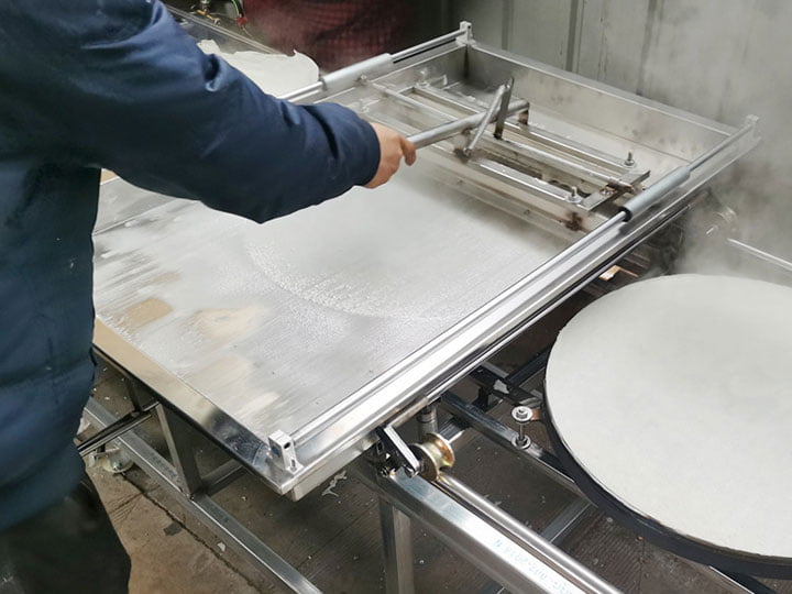 worker is making crepe